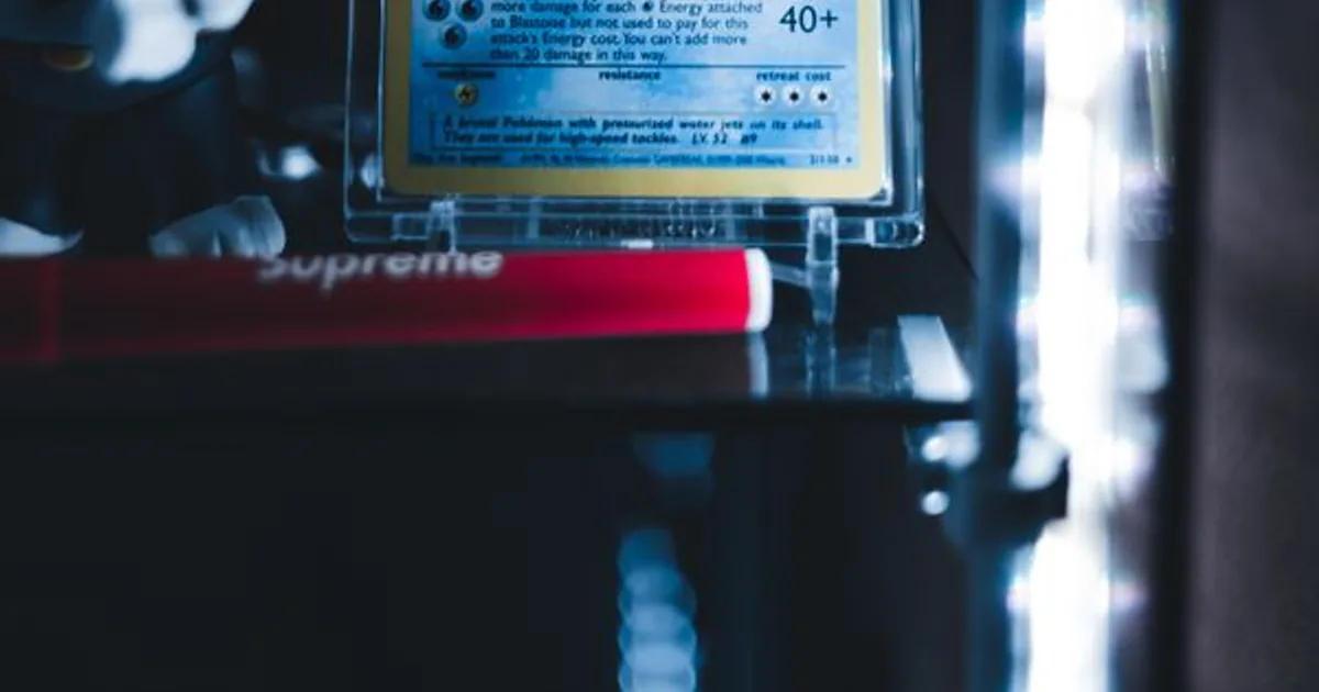 A trading card being photographed under even light for grading
