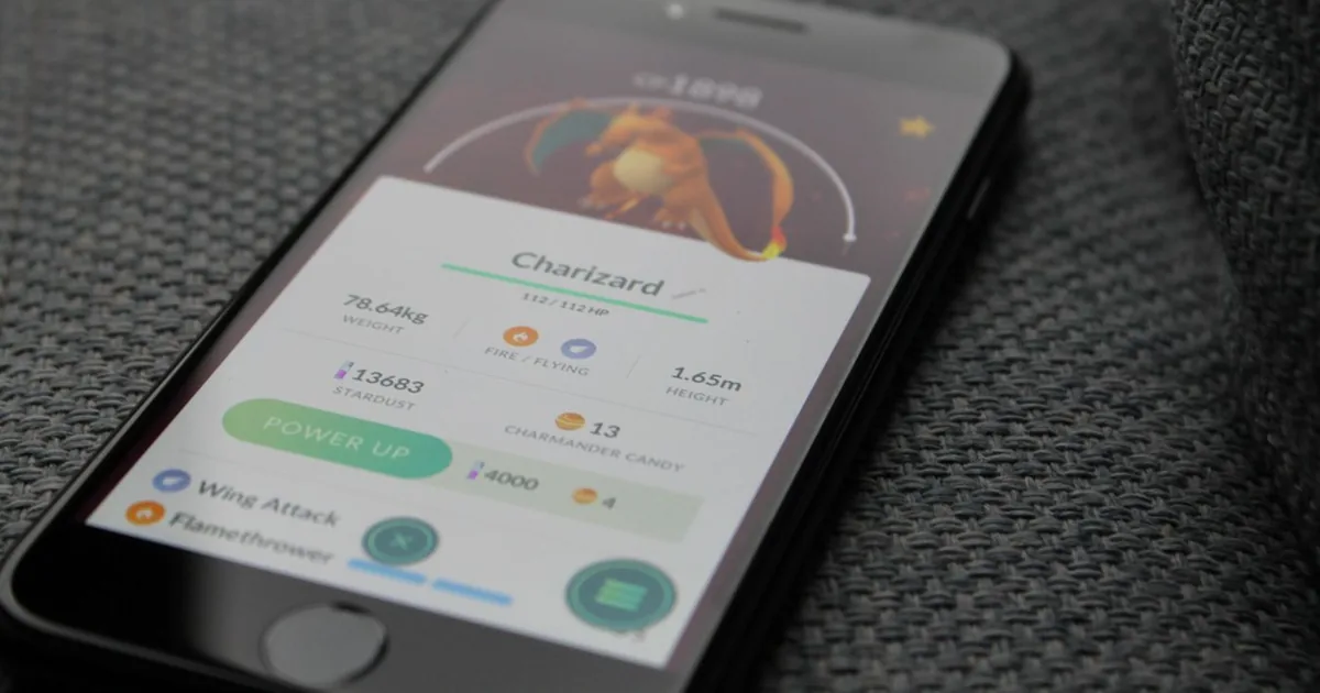 A phone scanning a trading card while an app identifies the set and price