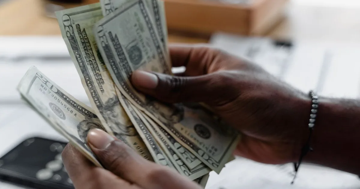 Counting cash earned from valuable trading cards