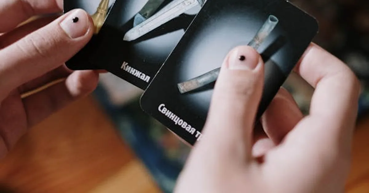 Person holding rare Pokémon cards ready to scan