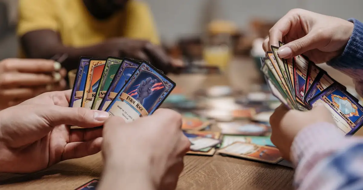 Players gathered around a table for a strategy card game